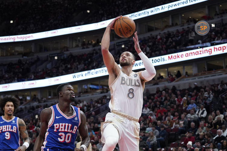 Jan 25, 2025; Chicago, Illinois, USA; Chicago Bulls guard Zach LaVine (8) shoots against Philadelphia 76ers center Adem Bona (30) during the first quarter at United Center. Credit: David Banks-Imagn Images