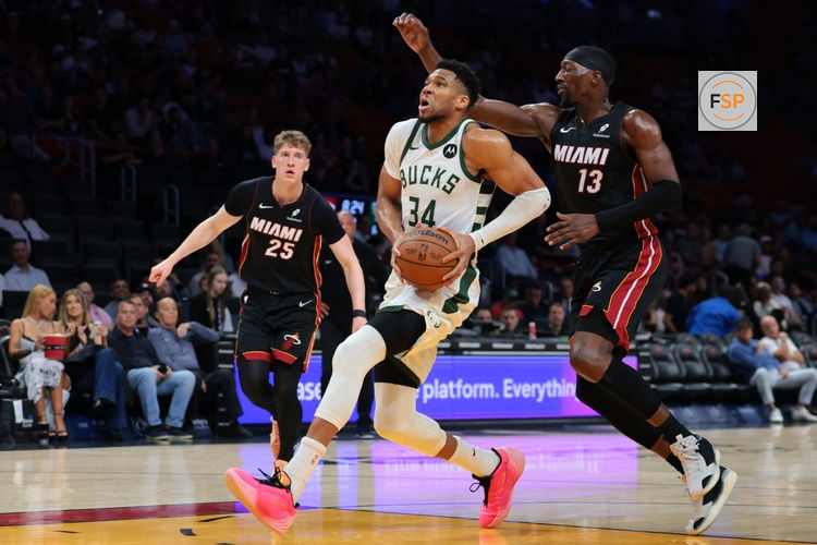 Mar 12, 2026; Miami, Florida, USA; Milwaukee Bucks forward Giannis Antetokounmpo (34) drives to the basket against Miami Heat center Bam Adebayo (13) during the first quarter at Kaseya Center. Credit: Sam Navarro-Imagn Images