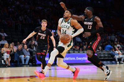 Mar 12, 2026; Miami, Florida, USA; Milwaukee Bucks forward Giannis Antetokounmpo (34) drives to the basket against Miami Heat center Bam Adebayo (13) during the first quarter at Kaseya Center. Mandatory Credit: Sam Navarro-Imagn Images