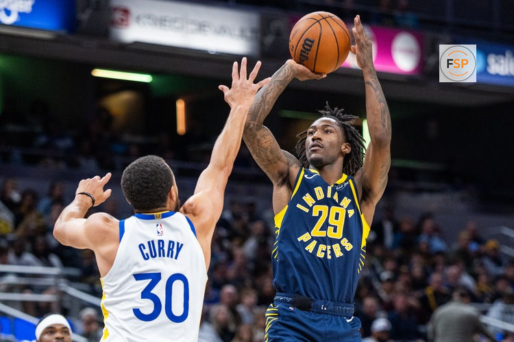 Nov 1, 2025; Indianapolis, Indiana, USA;  Indiana Pacers guard Quenton Jackson (29) shoots the ball while Golden State Warriors guard Stephen Curry (30) defends in the second half  at Gainbridge Fieldhouse. Credit: Trevor Ruszkowski-Imagn Images