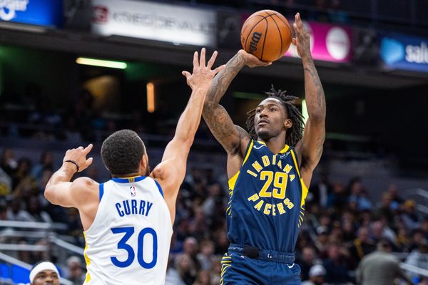 Nov 1, 2025; Indianapolis, Indiana, USA;  Indiana Pacers guard Quenton Jackson (29) shoots the ball while Golden State Warriors guard Stephen Curry (30) defends in the second half  at Gainbridge Fieldhouse. Mandatory Credit: Trevor Ruszkowski-Imagn Images