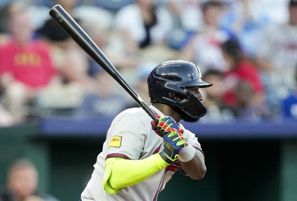 Jul 29, 2025; Kansas City, Missouri, USA; Atlanta Braves center fielder Michael Harris II (23) hits a single during the sixth inning against the Kansas City Royals at Kauffman Stadium. Mandatory Credit: Jay Biggerstaff-Imagn Images