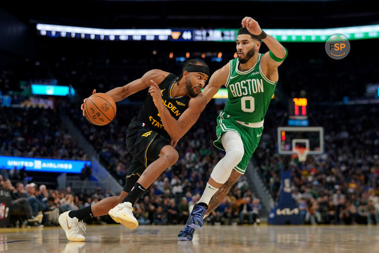 Jan 20, 2025; San Francisco, California, USA; Golden State Warriors guard Moses Moody (4) dribbles past Boston Celtics forward Jayson Tatum (0) in the third quarter at the Chase Center. Credit: Cary Edmondson-Imagn Images