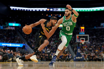 Jan 20, 2025; San Francisco, California, USA; Golden State Warriors guard Moses Moody (4) dribbles past Boston Celtics forward Jayson Tatum (0) in the third quarter at the Chase Center. Mandatory Credit: Cary Edmondson-Imagn Images