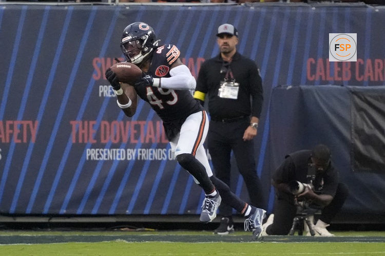 Sep 21, 2025; Chicago, Illinois, USA; Chicago Bears middle linebacker Tremaine Edmunds (49) intercepts a pass against the Dallas Cowboys during the second half at Soldier Field. Credit: David Banks-Imagn Images