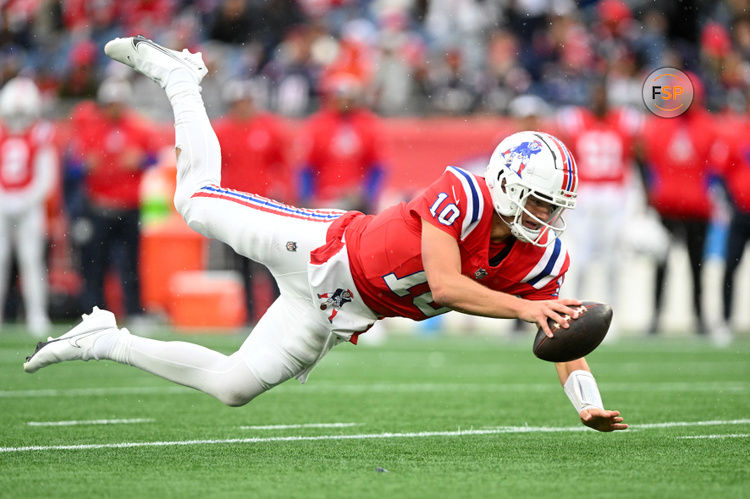 Oct 13, 2024; Foxborough, Massachusetts, USA; New England Patriots quarterback Drake Maye (10) dives for a first down against the Houston Texans during the first half at Gillette Stadium. Credit: Brian Fluharty-Imagn Images