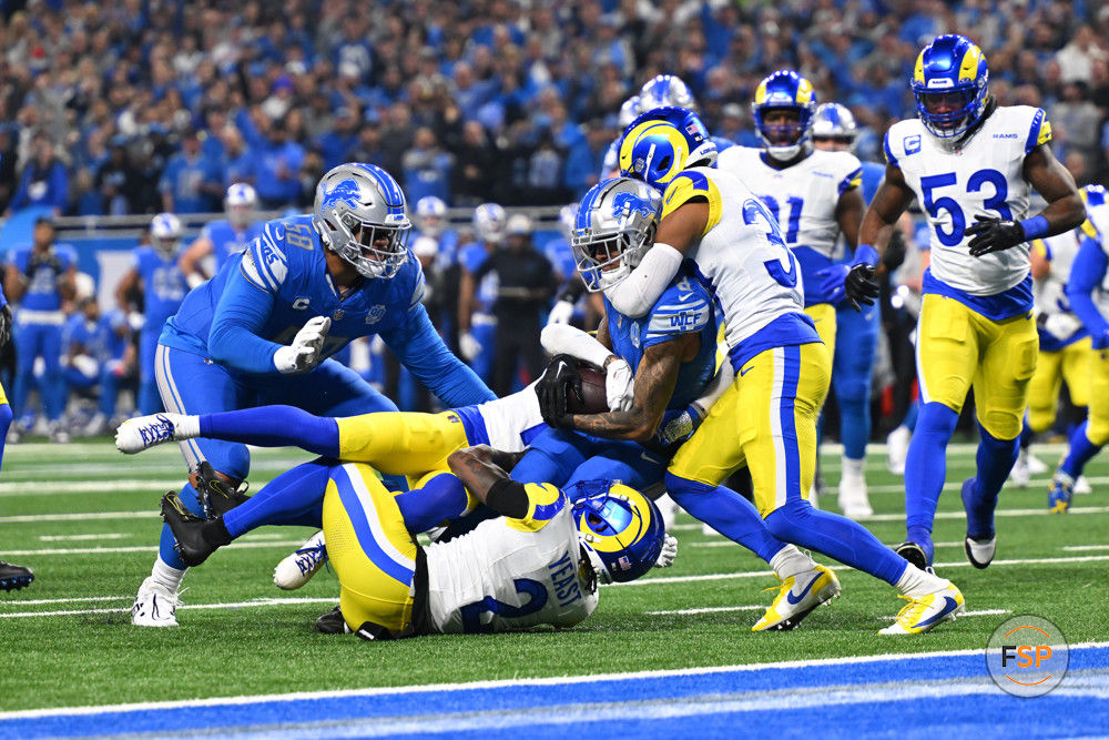 DETROIT, MI - JANUARY 14: Detroit Lions wide receiver Josh Reynolds (8) makes a catch and is immediately tackled during the NFC Wild Card game between the Detroit Lions and the Los Angeles Rams game on Sunday January 14, 2023 at Ford Field in Detroit, MI. (Photo by Steven King/Icon Sportswire)
