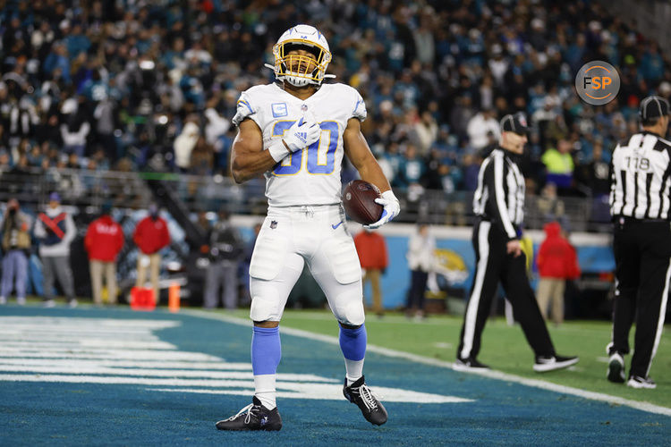 JACKSONVILLE, FL - JANUARY 14: Los Angeles Chargers running back Austin Ekeler (30) reacts after scoring a touchdown during the game between the Los Angeles Chargers and the Jacksonville Jaguars on January 14, 2023 at TIAA Bank Field in Jacksonville, Fl. (Photo by David Rosenblum/Icon Sportswire)