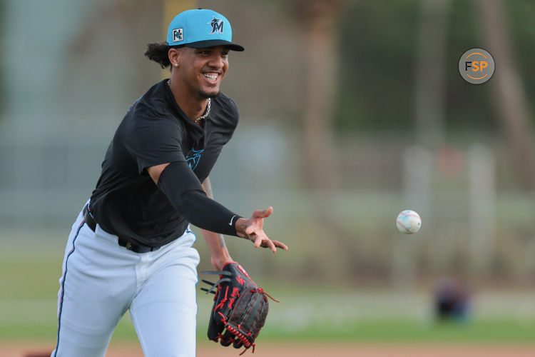 Feb 13, 2025; Jupiter, FL, USA; Miami Marlins starting pitcher Eury Perez (39) tosses the baseball to first base during a spring training workout at the Miami Marlins player development & scouting complex. Credit: Sam Navarro-Imagn Images