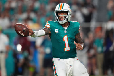 Sep 12, 2024; Miami Gardens, Florida, USA; Miami Dolphins quarterback Tua Tagovailoa (1) tosses the ball during the first half against the Buffalo Bills at Hard Rock Stadium. Mandatory Credit: Jasen Vinlove-Imagn Images