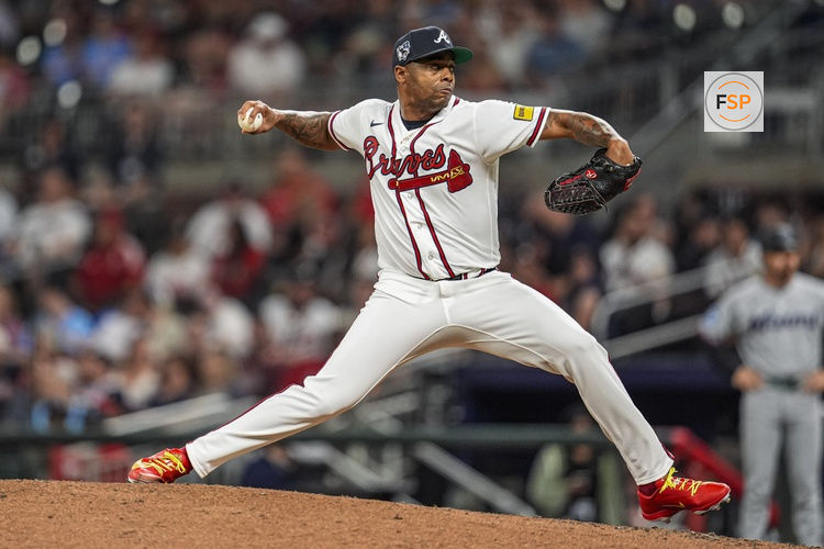 Apr 15, 2026; Cumberland, Georgia, USA; Atlanta Braves pitcher Raisel Iglesias (26) pitches against the Miami Marlins during the ninth inning at Truist Park. All players are wearing number 42 today in honor of Jackie Robinson. Credit: Dale Zanine-Imagn Images