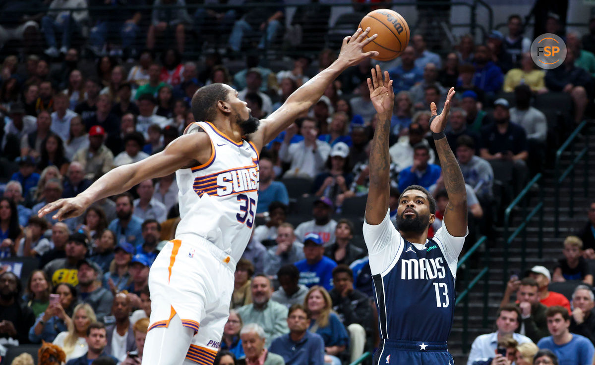 Nov 8, 2024; Dallas, Texas, USA;  Phoenix Suns forward Kevin Durant (35) defends the shot of Dallas Mavericks forward Naji Marshall (13) during the first quarter at American Airlines Center. Credit: Kevin Jairaj-Imagn Images