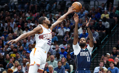 Nov 8, 2024; Dallas, Texas, USA;  Phoenix Suns forward Kevin Durant (35) defends the shot of Dallas Mavericks forward Naji Marshall (13) during the first quarter at American Airlines Center. Mandatory Credit: Kevin Jairaj-Imagn Images