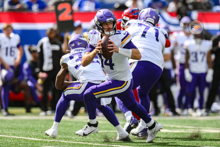 Sep 8, 2024; East Rutherford, New Jersey, USA; Minnesota Vikings quarterback Sam Darnold (14) rolls out to pass against the New York Giants during the second half at MetLife Stadium. Credit: John Jones-Imagn Images