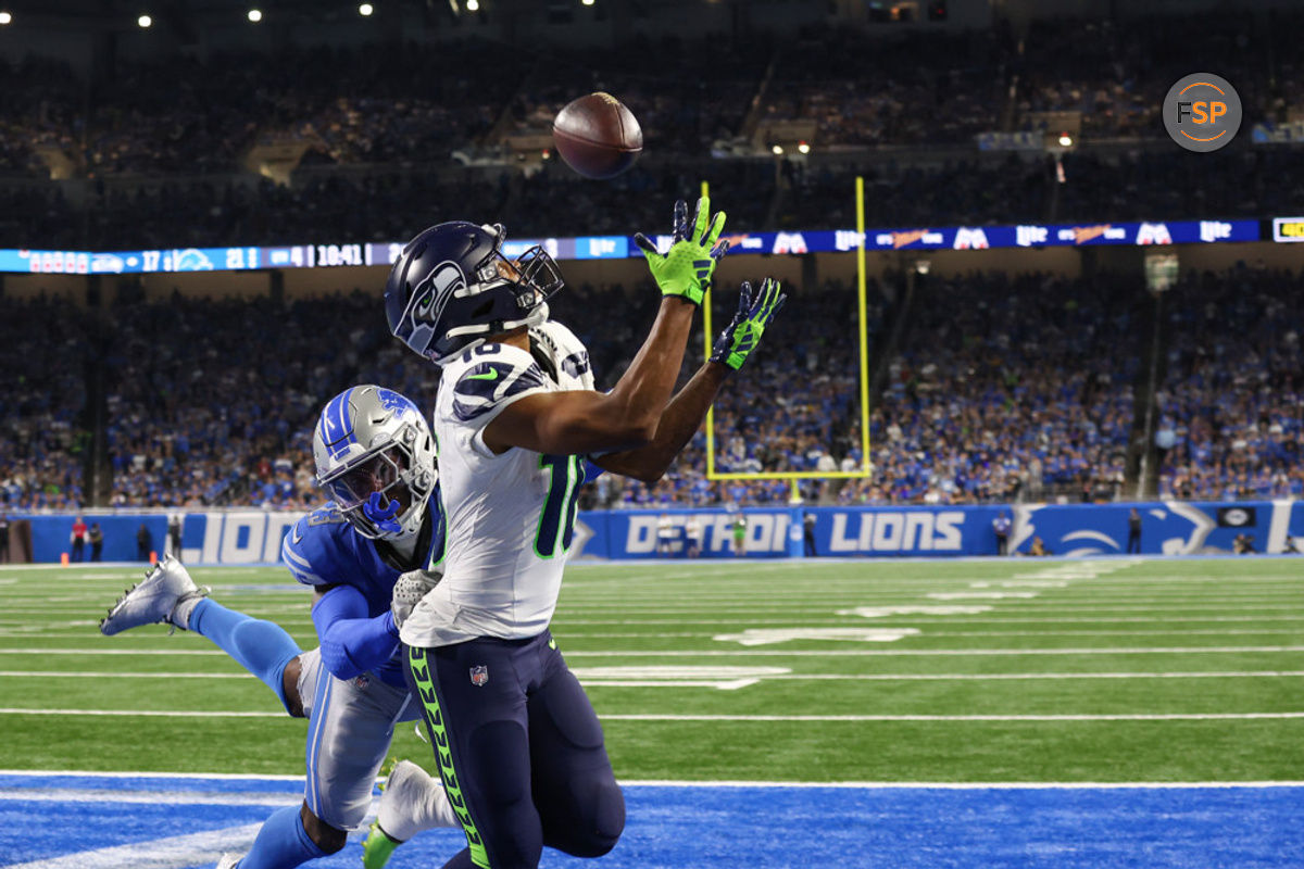 DETROIT, MI - SEPTEMBER 17:  Seattle Seahawks wide receiver Tyler Lockett (16) catches a touchdown pass in the back of the end zone against Detroit Lions cornerback Jerry Jacobs (23) during the fourth quarter of an NFL football game between the Seattle Seahawks and the Detroit Lions on September 17, 2023 at Ford Field in Detroit, Michigan.  (Photo by Scott W. Grau/Icon Sportswire)