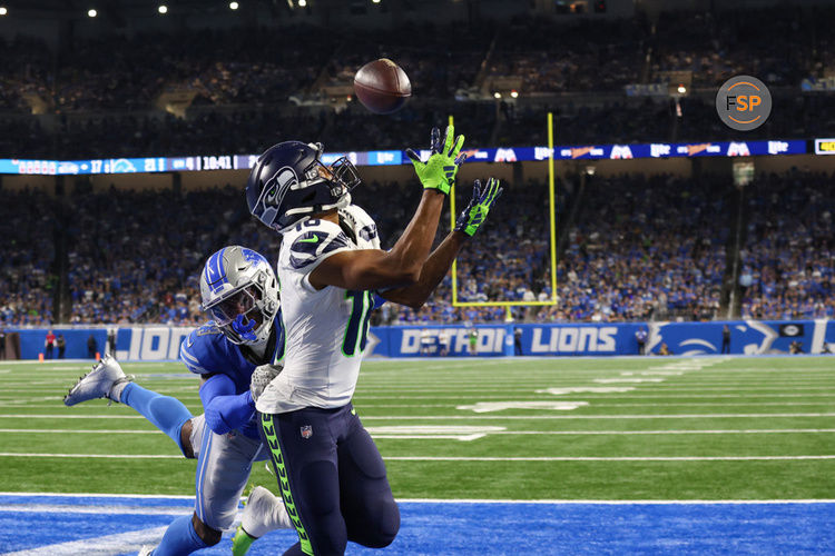 DETROIT, MI - SEPTEMBER 17:  Seattle Seahawks wide receiver Tyler Lockett (16) catches a touchdown pass in the back of the end zone against Detroit Lions cornerback Jerry Jacobs (23) during the fourth quarter of an NFL football game between the Seattle Seahawks and the Detroit Lions on September 17, 2023 at Ford Field in Detroit, Michigan.  (Photo by Scott W. Grau/Icon Sportswire)