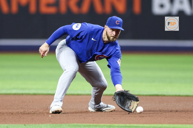 Apr 8, 2026; St. Petersburg, Florida, USA; Chicago Cubs first baseman Michael Busch (29) fields the ball against the Tampa Bay Rays in the fourth inning at Tropicana Field. Credit: Nathan Ray Seebeck-Imagn Images