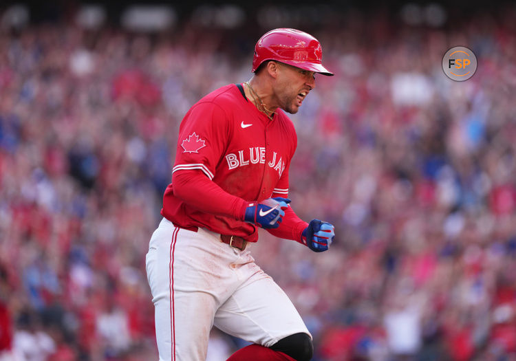 Jul 1, 2025; Toronto, Ontario, CAN;  Toronto Blue Jays right fielder George Springer (4) reacts after hitting a grand slam hone run against the New York Yankees during the seventh inning at Rogers Centre. Credit: Nick Turchiaro-Imagn Images