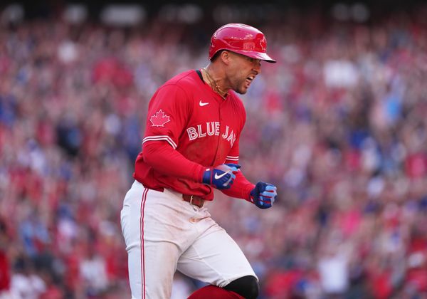 Jul 1, 2025; Toronto, Ontario, CAN;  Toronto Blue Jays right fielder George Springer (4) reacts after hitting a grand slam hone run against the New York Yankees during the seventh inning at Rogers Centre. Mandatory Credit: Nick Turchiaro-Imagn Images