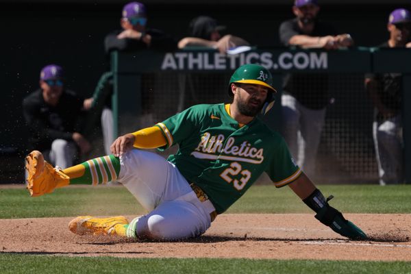 Mar 6, 2026; Mesa, Arizona, USA; Athletics catcher Shea Langeliers (23) scores a run against the Colorado Rockies in the first inning at Hohokam Stadium. Mandatory Credit: Rick Scuteri-Imagn Images
