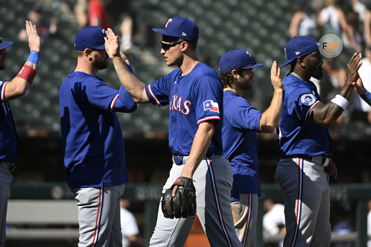 Aug 29, 2024; Chicago, Illinois, USA;  Texas Rangers shortstop Corey Seager (5) celebrates with teammates after the game against the Chicago White Sox at Guaranteed Rate Field. Credit: Matt Marton-USA TODAY Sports