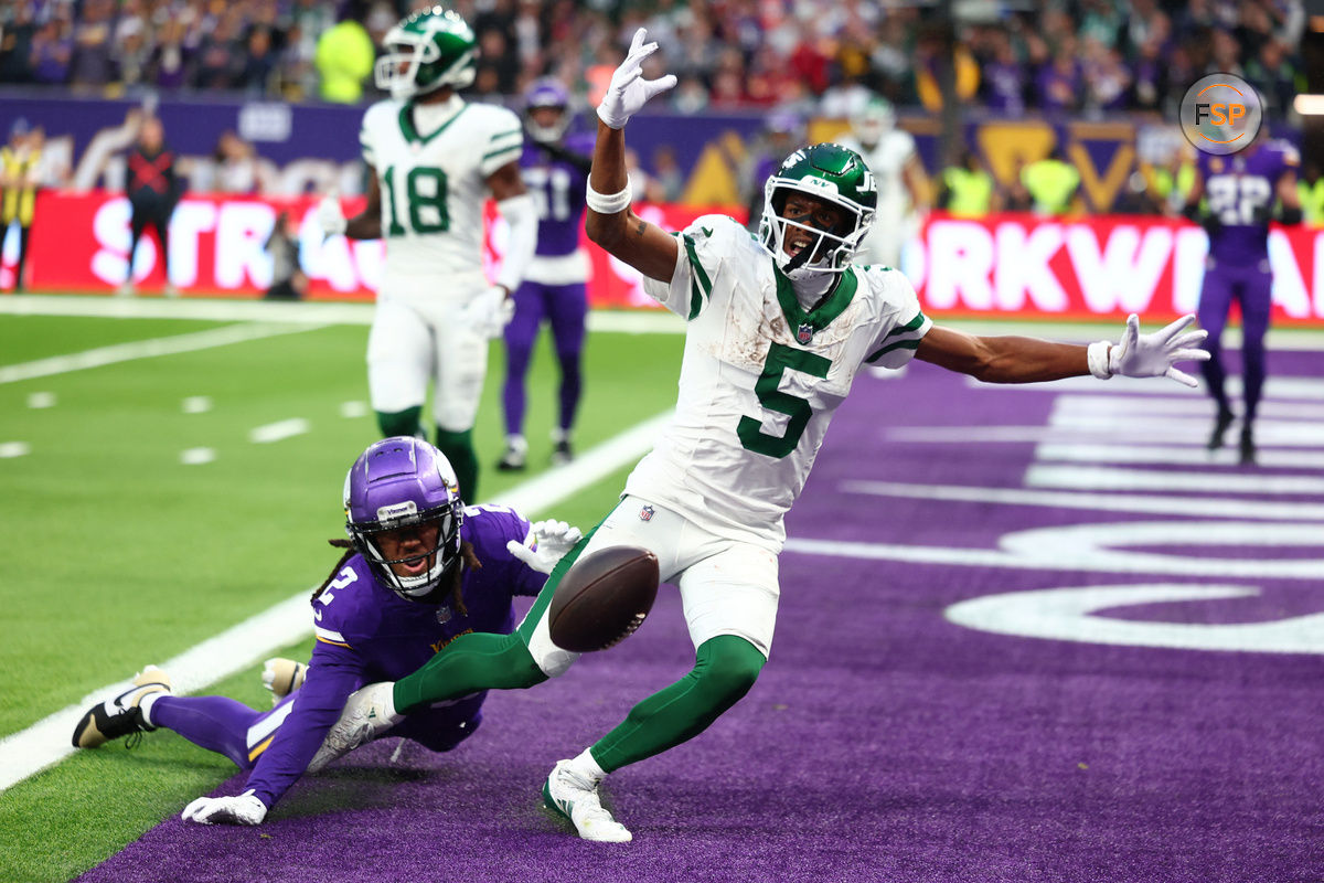 Oct 6, 2024; Tottenham, ENG; New York Jets wide receiver Garrett Wilson (5) appeals for pass interference from Minnesota Vikings Defensive Back Stephon Gilmore (2) in the 4th Quarter at Tottenham Hotspur Stadium. Credit: Shaun Brooks-Imagn Images