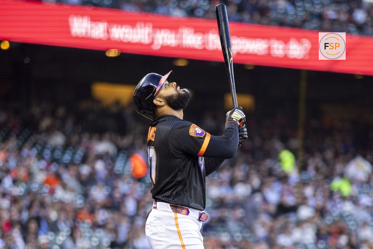 Jul 28, 2026; San Francisco, California, USA;  San Francisco Giants left fielder Heliot Ramos (17) hits a single against the Milwaukee Brewers during the first inning at Oracle Park. Credit: John Hefti-Imagn Images