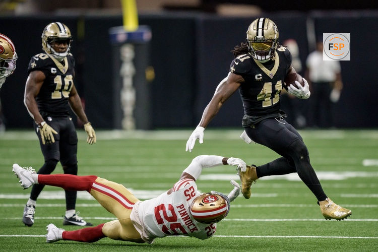 Sep 14, 2025; New Orleans, Louisiana, USA; New Orleans Saints running back Alvin Kamara (41) runs against San Francisco 49ers safety Jason Pinnock (25) during the second quarter at Caesars Superdome. Credit: Matthew Hinton-Imagn Images