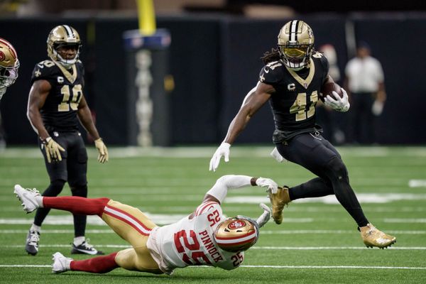 Sep 14, 2025; New Orleans, Louisiana, USA; New Orleans Saints running back Alvin Kamara (41) runs against San Francisco 49ers safety Jason Pinnock (25) during the second quarter at Caesars Superdome. Mandatory Credit: Matthew Hinton-Imagn Images