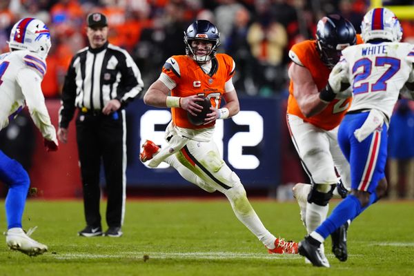 Jan 17, 2026; Denver, CO, USA; Denver Broncos quarterback Bo Nix (10) scrambles during overtime of an AFC Divisional Round playoff game against the Buffalo Bills at Empower Field at Mile High. Mandatory Credit: Ron Chenoy-Imagn Images