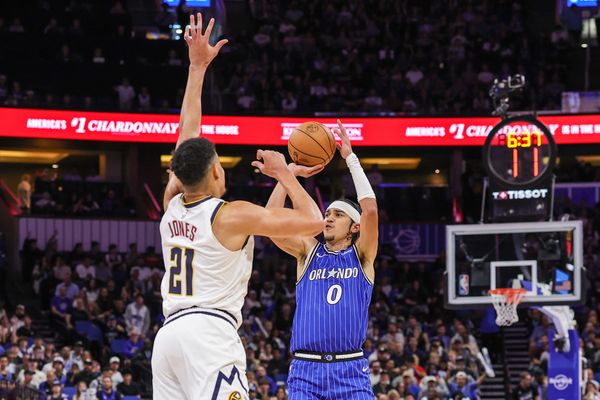 Dec 27, 2025; Orlando, Florida, USA; Orlando Magic guard Anthony Black (0) shoots against Denver Nuggets forward Spencer Jones (21) during the first quarter at Kia Center. Mandatory Credit: Mike Watters-Imagn Images