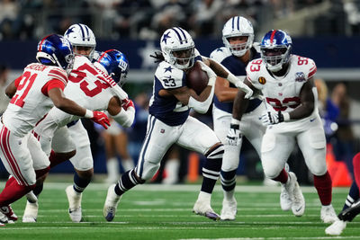 Nov 28, 2024; Arlington, Texas, USA;  Dallas Cowboys running back Rico Dowdle (23) runs the ball as New York Giants cornerback Adoree' Jackson (21) defends during the first half at AT&T Stadium. Mandatory Credit: Chris Jones-Imagn Images