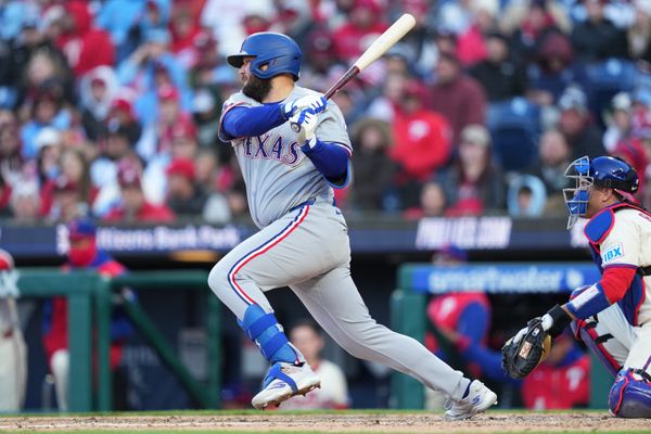 Mar 28, 2026; Philadelphia, Pennsylvania, USA; Texas Rangers infielder Jake Burger (21) hits a single against the Philadelphia Phillies in the eighth inning at Citizens Bank Park. Mandatory Credit: Kyle Ross-Imagn Images