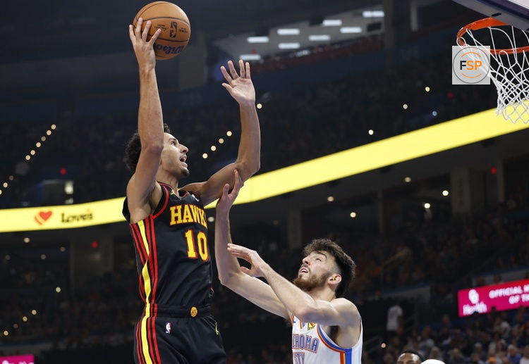 Oct 27, 2024; Oklahoma City, Oklahoma, USA; Atlanta Hawks forward Zaccharie Risacher (10) shoots over Oklahoma City Thunder forward Chet Holmgren (7) during the second quarter at Paycom Center. Credit: Alonzo Adams-Imagn Images