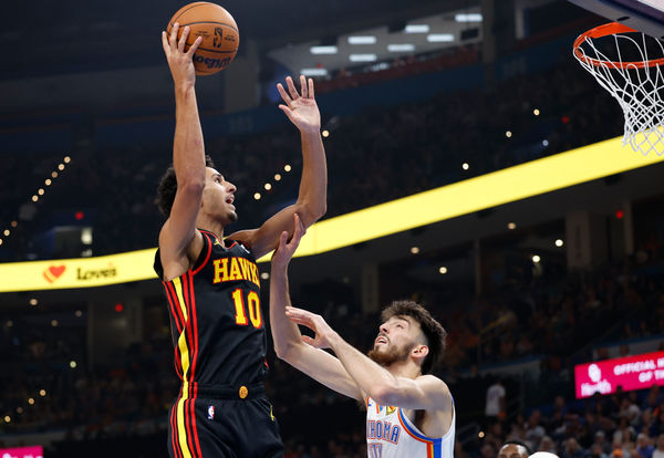 Oct 27, 2024; Oklahoma City, Oklahoma, USA; Atlanta Hawks forward Zaccharie Risacher (10) shoots over Oklahoma City Thunder forward Chet Holmgren (7) during the second quarter at Paycom Center. Mandatory Credit: Alonzo Adams-Imagn Images