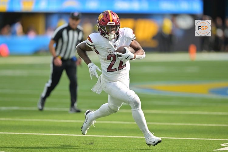 Oct 5, 2025; Inglewood, California, USA; Washington Commanders running back Jacory Croskey-Merritt (22) runs for a touchdown against the Los Angeles Chargers in the first half at SoFi Stadium. Credit: Jayne Kamin-Oncea-Imagn Images