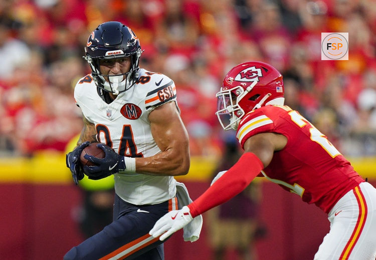Aug 22, 2025; Kansas City, Missouri, USA; Chicago Bears tight end Colston Loveland (84) runs with the ball against Kansas City Chiefs safety Jaden Hicks (21) during the first half at GEHA Field at Arrowhead Stadium. Credit: Jay Biggerstaff-Imagn Images