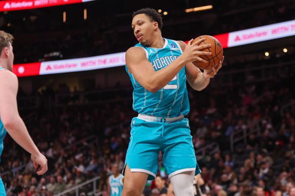 Feb 7, 2026; Atlanta, Georgia, USA; Charlotte Hornets forward Grant Williams (2) grabs a rebound against the Atlanta Hawks in the second quarter at State Farm Arena. Mandatory Credit: Brett Davis-Imagn Images