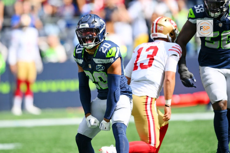 Sep 7, 2025; Seattle, Washington, USA; Seattle Seahawks linebacker Derick Hall (58) and Seattle Seahawks safety Julian Love (20) celebrate after a play during the first half against San Francisco 49ers at Lumen Field. Credit: Steven Bisig-Imagn Images