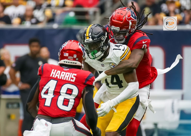 HOUSTON, TX - OCTOBER 01:  Houston Texans cornerback Shaquill Griffin (0) tackles Pittsburgh Steelers wide receiver George Pickens (14) in the second quarter during the NFL game between the Pittsburgh Steelers and Houston Texans on October 1, 2023 at NRG Stadium in Houston, Texas.  (Photo by Leslie Plaza Johnson/Icon Sportswire)