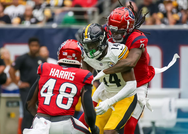 HOUSTON, TX - OCTOBER 01:  Houston Texans cornerback Shaquill Griffin (0) tackles Pittsburgh Steelers wide receiver George Pickens (14) in the second quarter during the NFL game between the Pittsburgh Steelers and Houston Texans on October 1, 2023 at NRG Stadium in Houston, Texas.  (Photo by Leslie Plaza Johnson/Icon Sportswire)