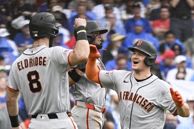 Jun 5, 2026; Chicago, Illinois, USA;  San Francisco Giants third baseman Matt Chapman (26), right, high fives San Francisco Giants second baseman Luis Arraez (1) and designated hitter Bryce Eldridge (8) after he hits a grand slam against the Chicago Cubs during the fourth inning at Wrigley Field. Mandatory Credit: Matt Marton-Imagn Images