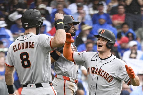 Jun 5, 2026; Chicago, Illinois, USA;  San Francisco Giants third baseman Matt Chapman (26), right, high fives San Francisco Giants second baseman Luis Arraez (1) and designated hitter Bryce Eldridge (8) after he hits a grand slam against the Chicago Cubs during the fourth inning at Wrigley Field. Mandatory Credit: Matt Marton-Imagn Images