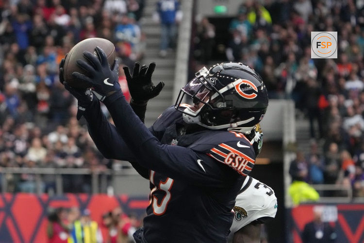 Oct 13, 2024; London, United Kingdom; Chicago Bears wide receiver Keenan Allen (13) catches a three-yard touchdown pass against Jacksonville Jaguars cornerback Montaric Brown (30) in the second half during an NFL International Series game at Tottenham Hotspur Stadium. Credit: Kirby Lee-Imagn Images