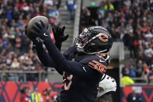 Oct 13, 2024; London, United Kingdom; Chicago Bears wide receiver Keenan Allen (13) catches a three-yard touchdown pass against Jacksonville Jaguars cornerback Montaric Brown (30) in the second half during an NFL International Series game at Tottenham Hotspur Stadium. Mandatory Credit: Kirby Lee-Imagn Images