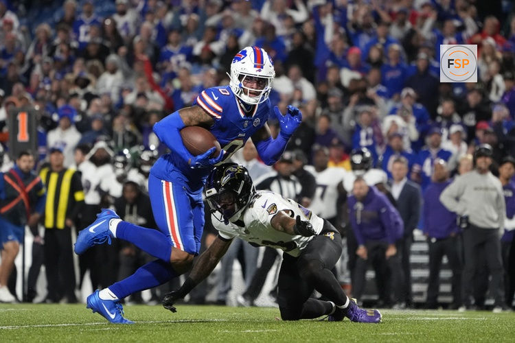 Sep 7, 2025; Orchard Park, New York, USA;  Buffalo Bills wide receiver Keon Coleman (0) runs the ball against Baltimore Ravens cornerback Jaire Alexander (23) during the fourth quarter at Highmark Stadium. Credit: Gregory Fisher-Imagn Images