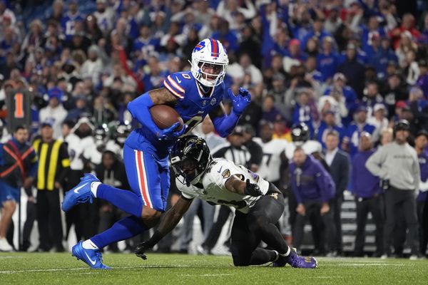 Sep 7, 2025; Orchard Park, New York, USA;  Buffalo Bills wide receiver Keon Coleman (0) runs the ball against Baltimore Ravens cornerback Jaire Alexander (23) during the fourth quarter at Highmark Stadium. Mandatory Credit: Gregory Fisher-Imagn Images