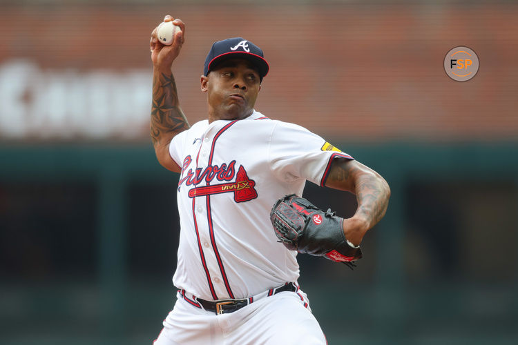 Sep 30, 2024; Atlanta, Georgia, USA; Atlanta Braves relief pitcher Raisel Iglesias (26) throws against the New York Mets in the eighth inning at Truist Park. Credit: Brett Davis-Imagn Images
