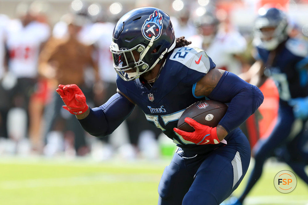 TAMPA, FL - NOVERMBER 12: Tennessee Titans Running Back Derrick Henry (22) carries the ball during the regular season game between the Tennessee Titans and the Tampa Bay Buccaneers on November 12, 2023 at Raymond James Stadium in Tampa, Florida. (Photo by Cliff Welch/Icon Sportswire)