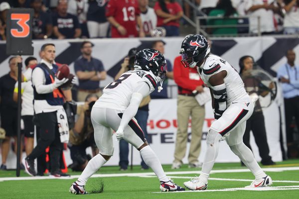 Sep 15, 2025; Houston, Texas, USA; Houston Texans safety C.J. Gardner-Johnson (8) and Houston Texans linebacker Azeez Al-Shaair (0) celebrate after making a tackle during the second quarter against the Tampa Bay Buccaneers at NRG Stadium. Mandatory Credit: Thomas Shea-Imagn Images